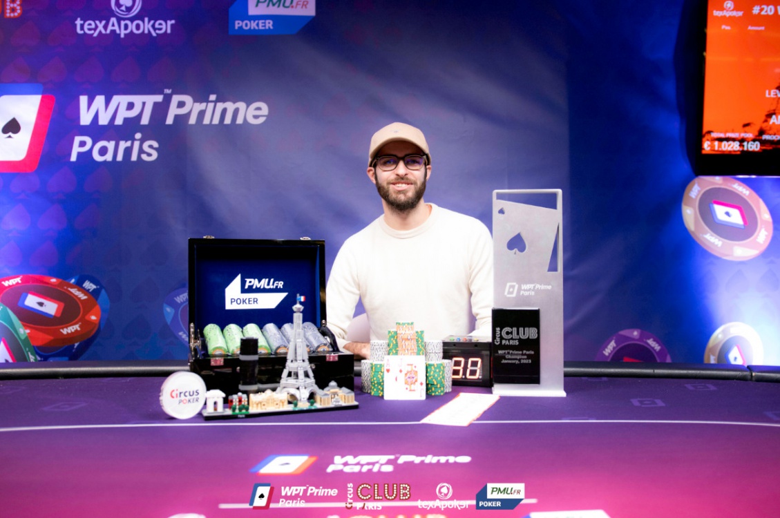 Fabrice Bigot seated behind a trophy and chips at WPT Prime Paris