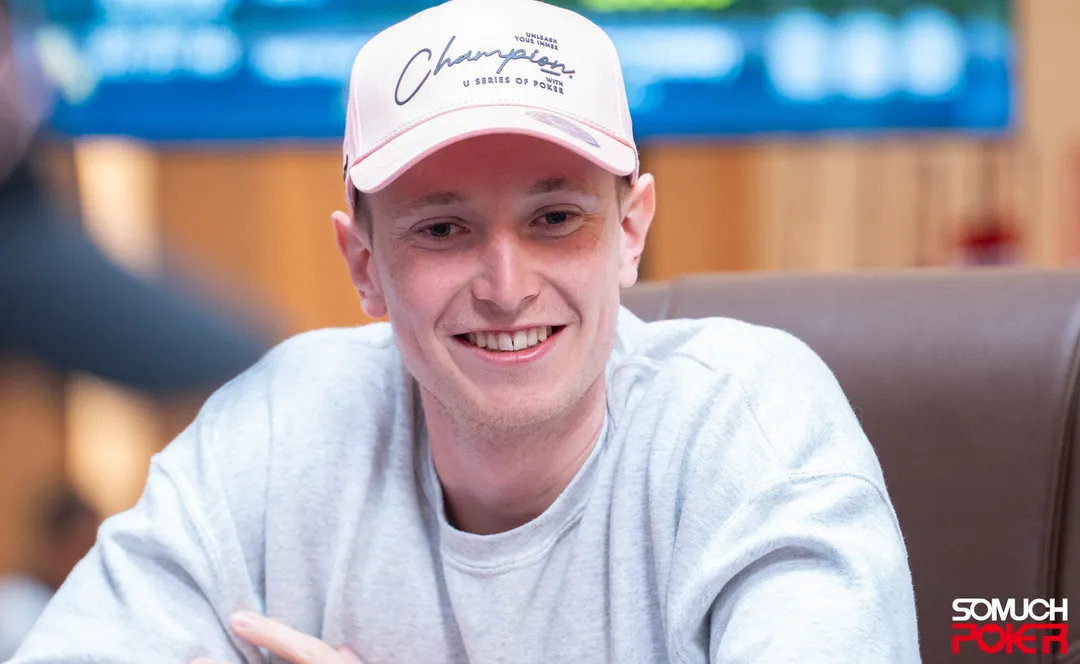 Max Buschmann smiling at the table during a live tournament